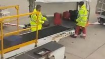 Baggage handler filmed damaging suitcase