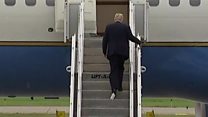 Trump boards plane with paper stuck to his shoe