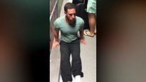 Disabled man drags himself through airport