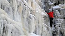 Climbers tackle frozen waterfall