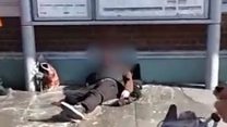 Train staff throw water at homeless man