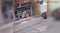CCTV: Man nearly hit by falling bricks