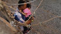 US migrants spend days held under a bridge