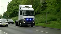 Driver makes card payment on phone at wheel