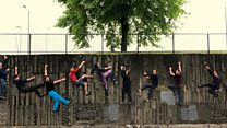 Mountaineers climb in city underpass