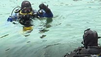 The divers cleaning up the seabed