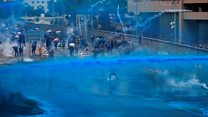 Water cannon fired at defiant Hong Kong protesters