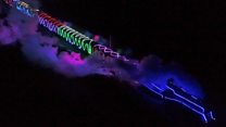 Steam train cuts blaze of colour through the night