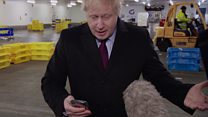 Johnson puts reporter's phone in pocket