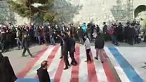 Students refuse to walk over US and Israeli flags