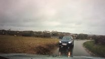 Car filmed on wrong side of road near RAF base