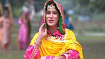 The man acing women's folk dance in India