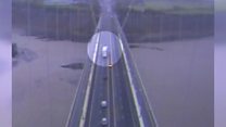 Moment lorry blown over on bridge caught on CCTV