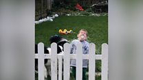 Child catches snowball in his mouth