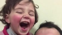 The Syrian girl who laughs in the face of war