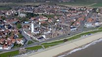 Aerial shots show east coast seafronts deserted