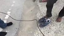 Reporter's gift of shoes to migrant goes viral