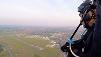 Paramotor pilot captures city airport from the air