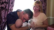 Couple finally meet son born to surrogate mother