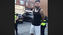 'What are you putting me in cuffs for?'