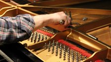 John Paul Jones preparing the piano