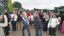 Re-enacting the Olympic Torch relay at Wimbledon