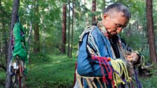 Chochigar Kes-Kam puts on his shaman coat before a ritual - one of several hundred shamans practising in Tuva today.