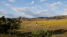 Sasha Maynagashev rides off towards the taiga in search of his horses, which roam free up to 40 km from the camp