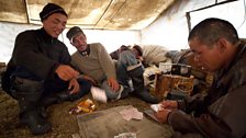 Danil and Andrei Kyrganai play cards with Sholban Bimba.