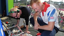 Greg Rutherford checks out the papers with Chris Evans