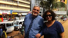 Rupal walks on the Kampala Road with her cousin Bharat.