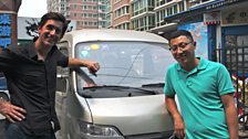 Justin Rowlatt and his guide Qiao Xin collect their ‘bread van’, which they will be driving on their 2,600 mile journey.