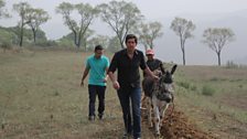 Justin at Heicaoyan, with farmer Wang Guisheng. The village farmers have no cars, and one donkey - shared with another village.