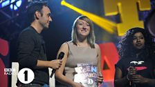 Jenna receives her Teen Hero award from Aled and Misha B