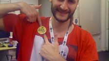 Kissy in the office at work with his scary T shirt...but sporting a good look with his Kissy Klub badge!