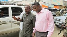 The mayor meets a local businessman in Mogadishu