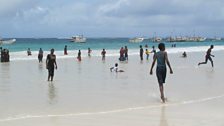 Children play on Mogadishu's sandy beach