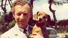 Britten holding his dog Clytie in The Red House garden, Aldeburgh, late 1950s