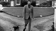 Benjamin Britten in front of The Red House with Jove, ca. 1966