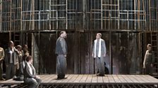 English National Opera Chorus with Roland Wood as Pilgrim and Timothy Robinson as The Interpreter (centre L-R)