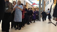 Hospital staff wait patiently to meet William and Kate.