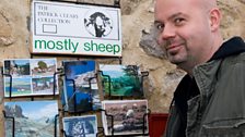 Dom's found the Post Office and is checking out the postcards...