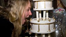 Rach inspects the wedding cake