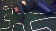 These people are crazy - they've created a crime scene murder victim outline on their floor!