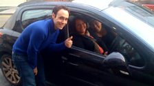 Here are some people in a car - they get the thumbs up from Aled