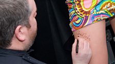 And in return, Chris signs an autograph, immediately making Joss' legs priceless...