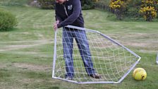 Comedy Dave attempts to erect a goal for a bit of footy.