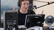 Greg James does his best Chris Moyles impression for the webcam.