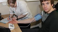 Greg gets his blood pressure read by Sharon at a local pharmacy