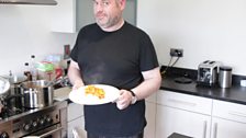 Chris proudly shows off his curry